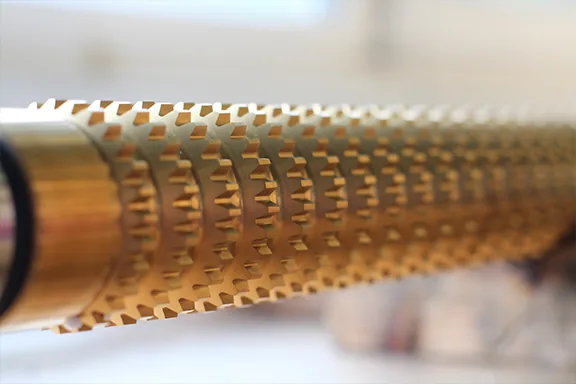 Close-up of gold PVD coated spline broach tooth profile manufactured by United Broach Company