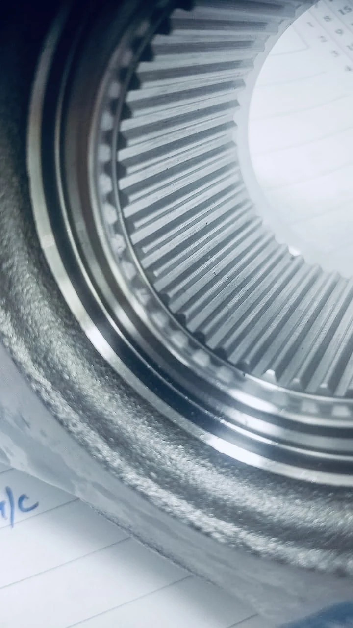 Close-up inspection of internal spline gear component teeth manufactured by United Broach Company