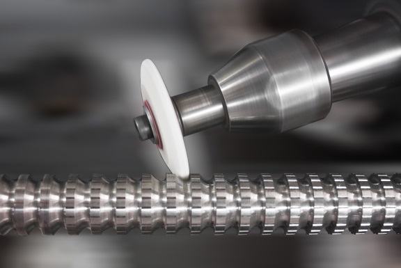 Grinding wheel finishing a spline shaft for precision surface finish at United Broach