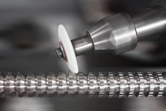 Grinding wheel finishing a spline shaft for precision surface finish at United Broach Company
